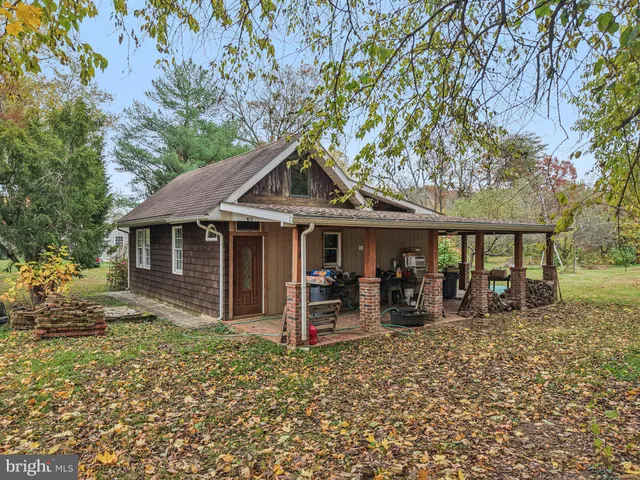 an front view of a house with garden