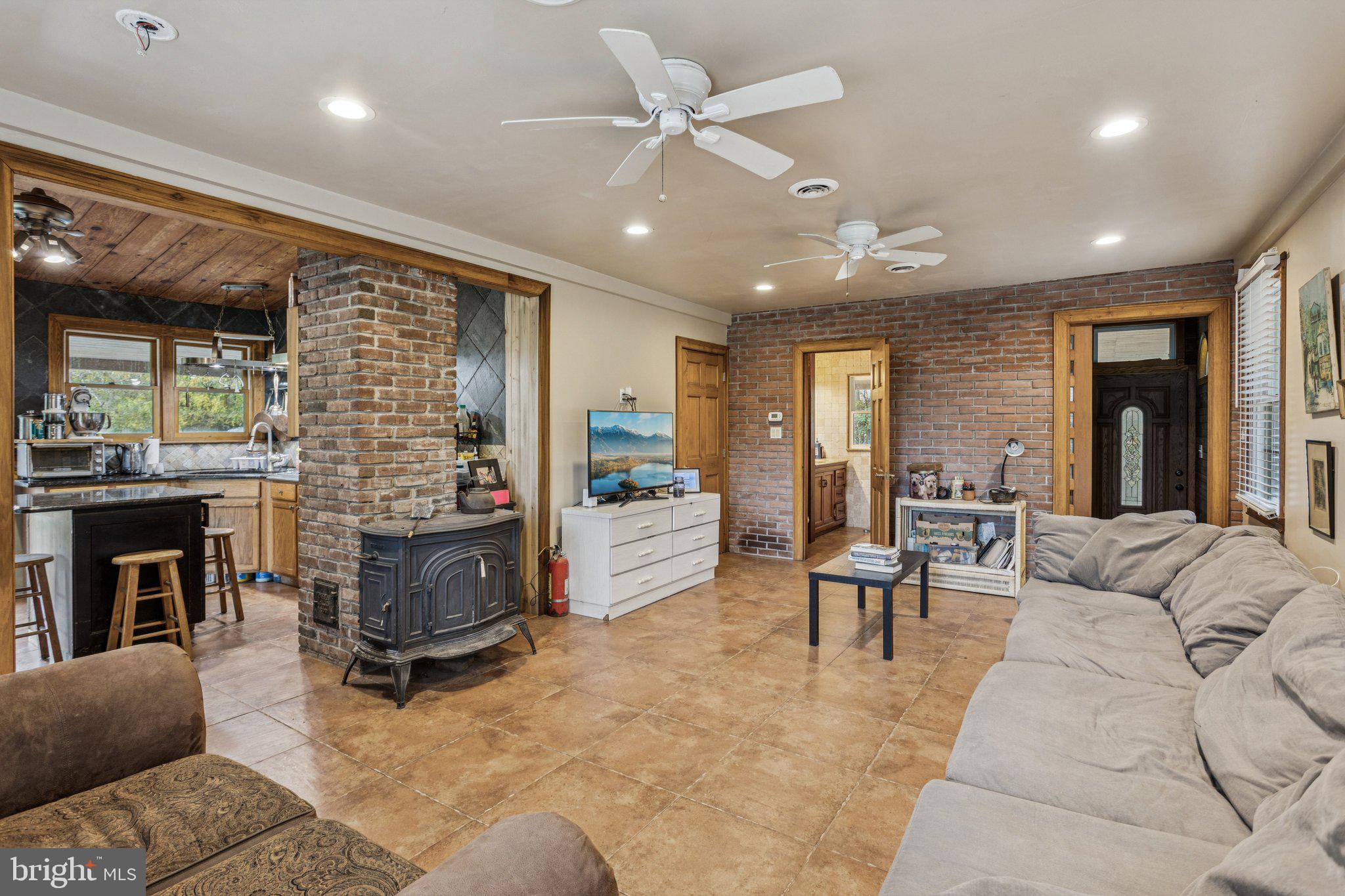 75 Piercetown Road Millville, NJ 08332 - Photo 11 of 49 a living room with furniture and a fireplace
