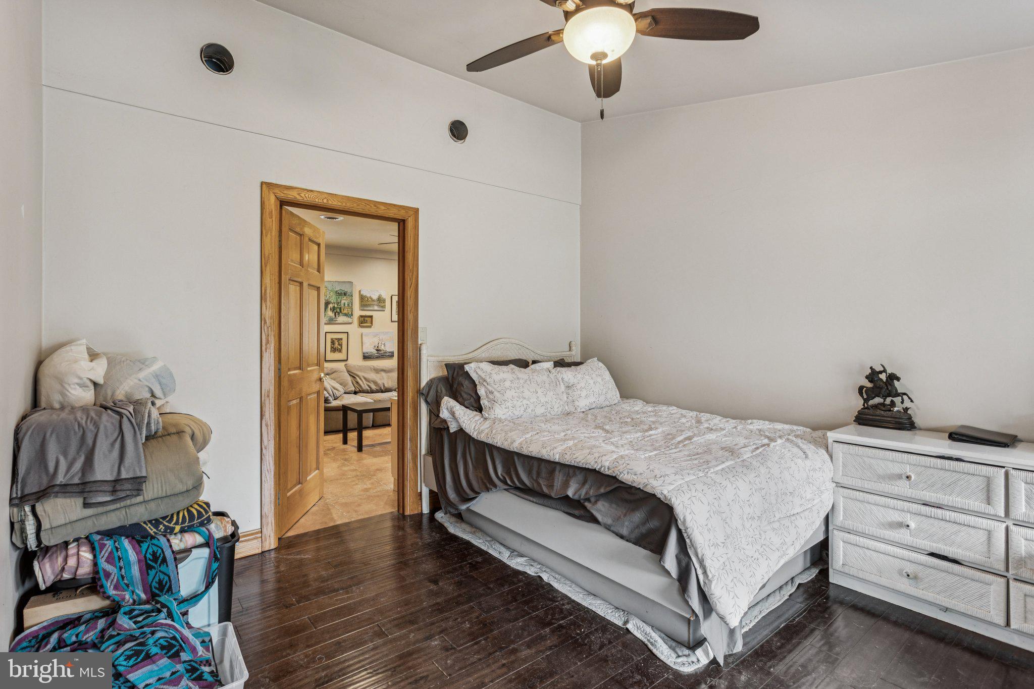 75 Piercetown Road Millville, NJ 08332 - Photo 22 of 49 a bedroom with a bed and wooden floor