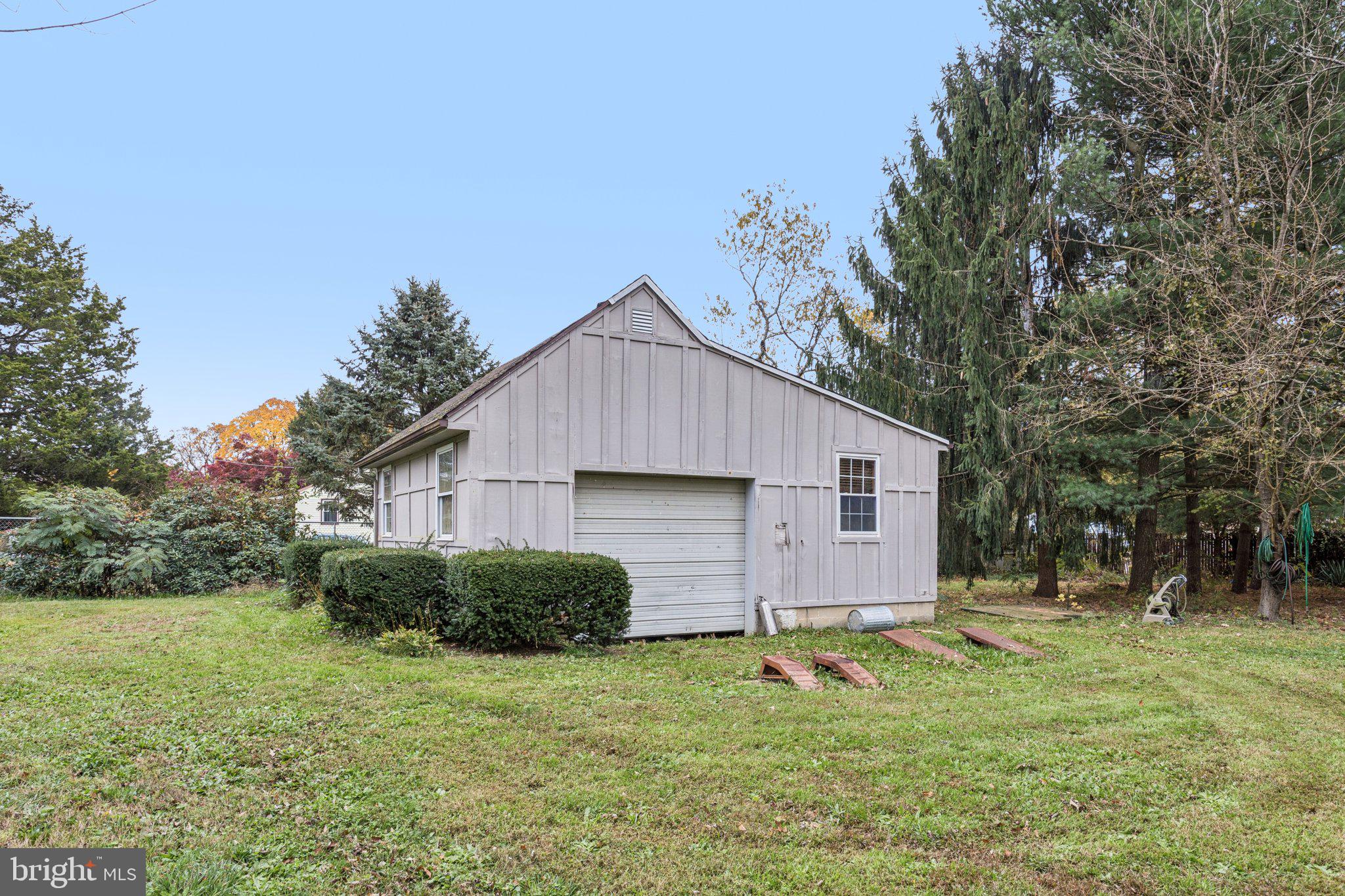 75 Piercetown Road Millville, NJ 08332 - Photo 28 of 49 a backyard of a house with plants and large tree