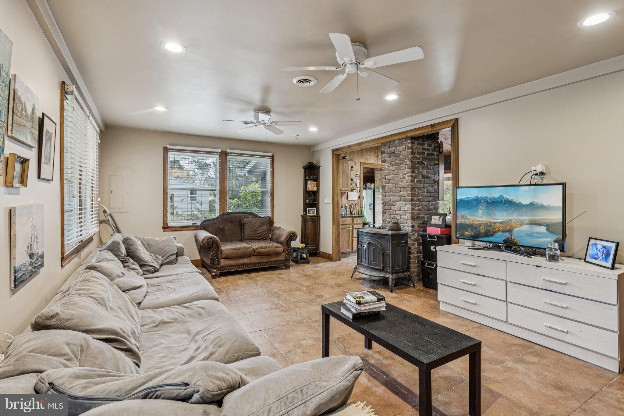 75 Piercetown Road Millville, NJ 08332 - Photo 10 of 49 a living room with furniture and a flat screen tv
