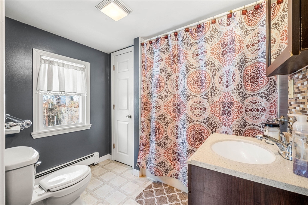 12 Arthur Street Gloucester, MA 01930 - Photo 13 of 33 a bathroom with a sink toilet and shower