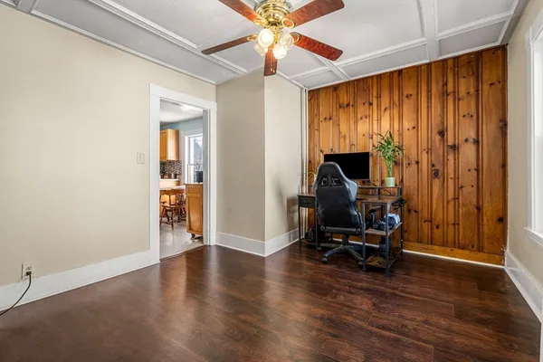 an empty room with furniture and a window