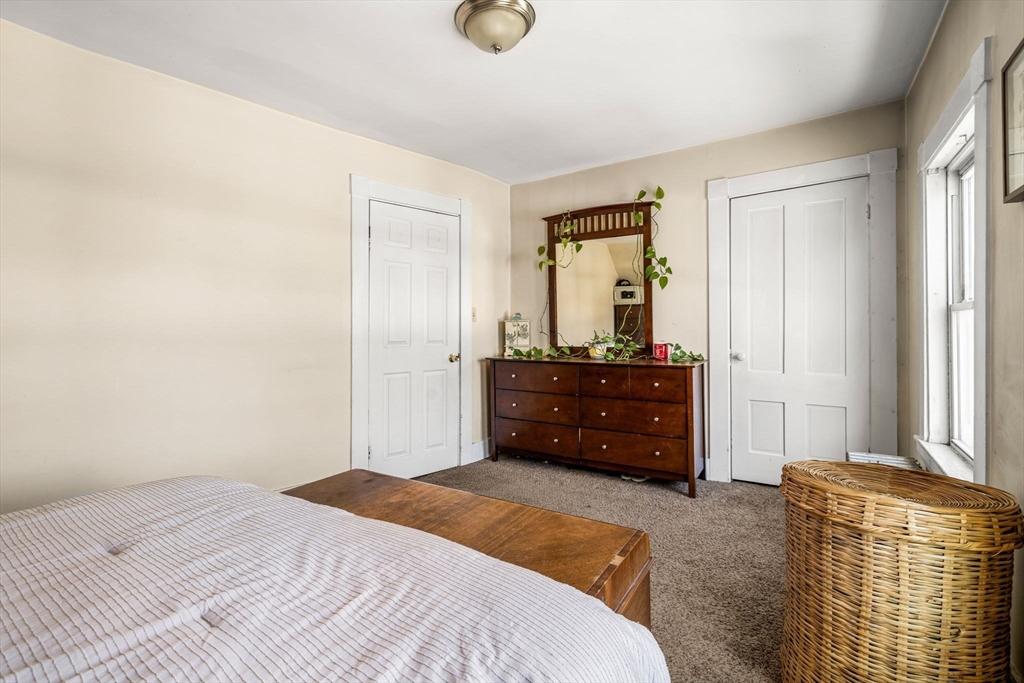 12 Arthur Street Gloucester, MA 01930 - Photo 21 of 33 a bedroom with a bed and a dresser