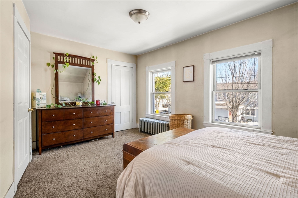 12 Arthur Street Gloucester, MA 01930 - Photo 22 of 33 a bedroom with a bed and a window