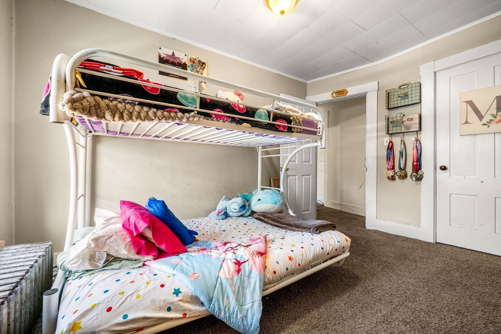 12 Arthur Street Gloucester, MA 01930 - Photo 25 of 33 a bedroom with two beds and a window