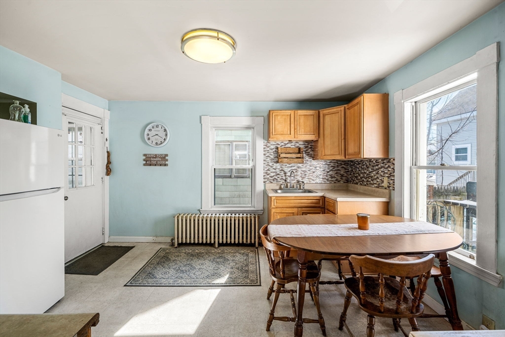 12 Arthur Street Gloucester, MA 01930 - Photo 10 of 33 a view of a dining room with furniture and wooden floor