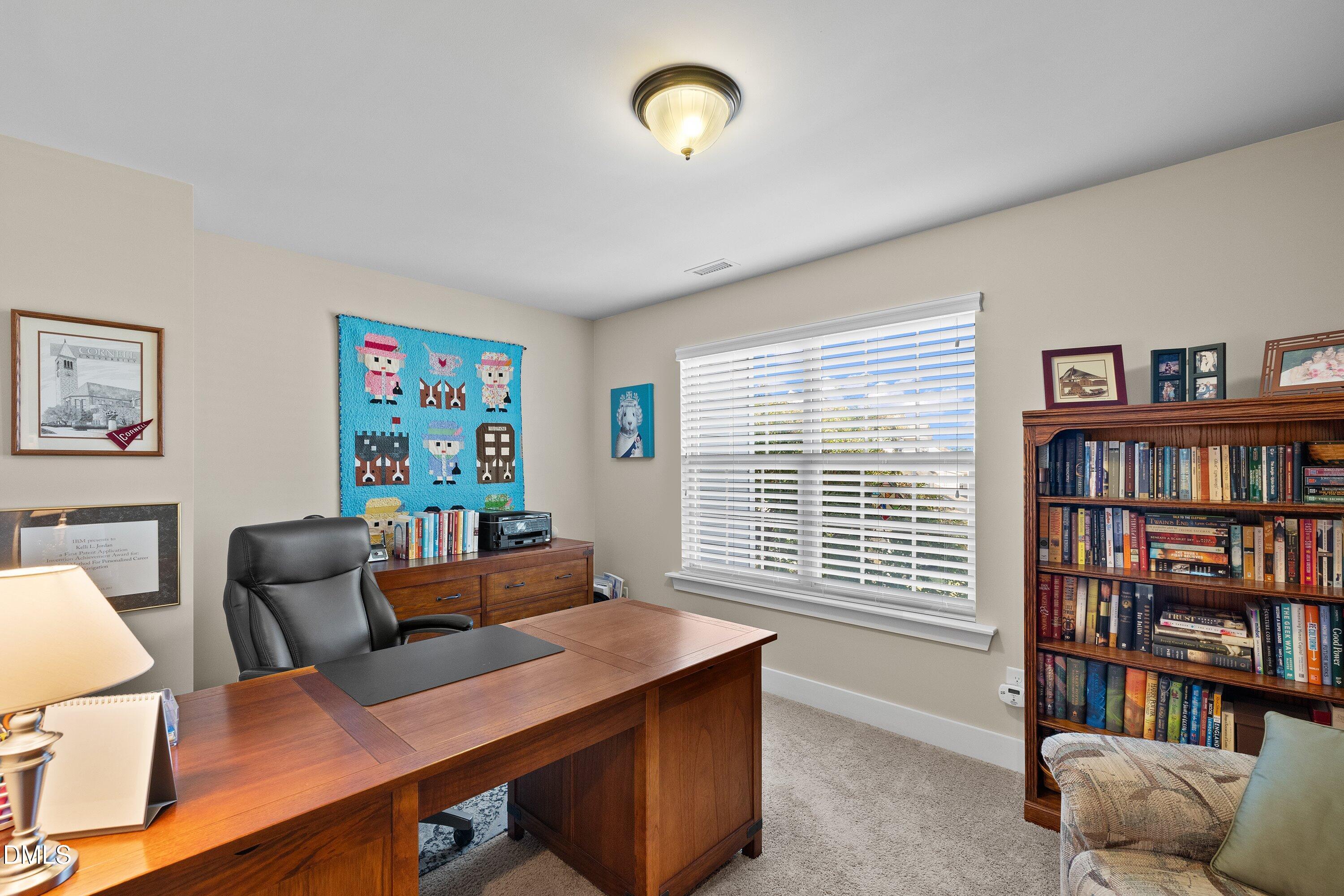 9302 Alcazar Walk Raleigh, NC 27617 - Photo 16 of 40 a room with furniture and a book shelf