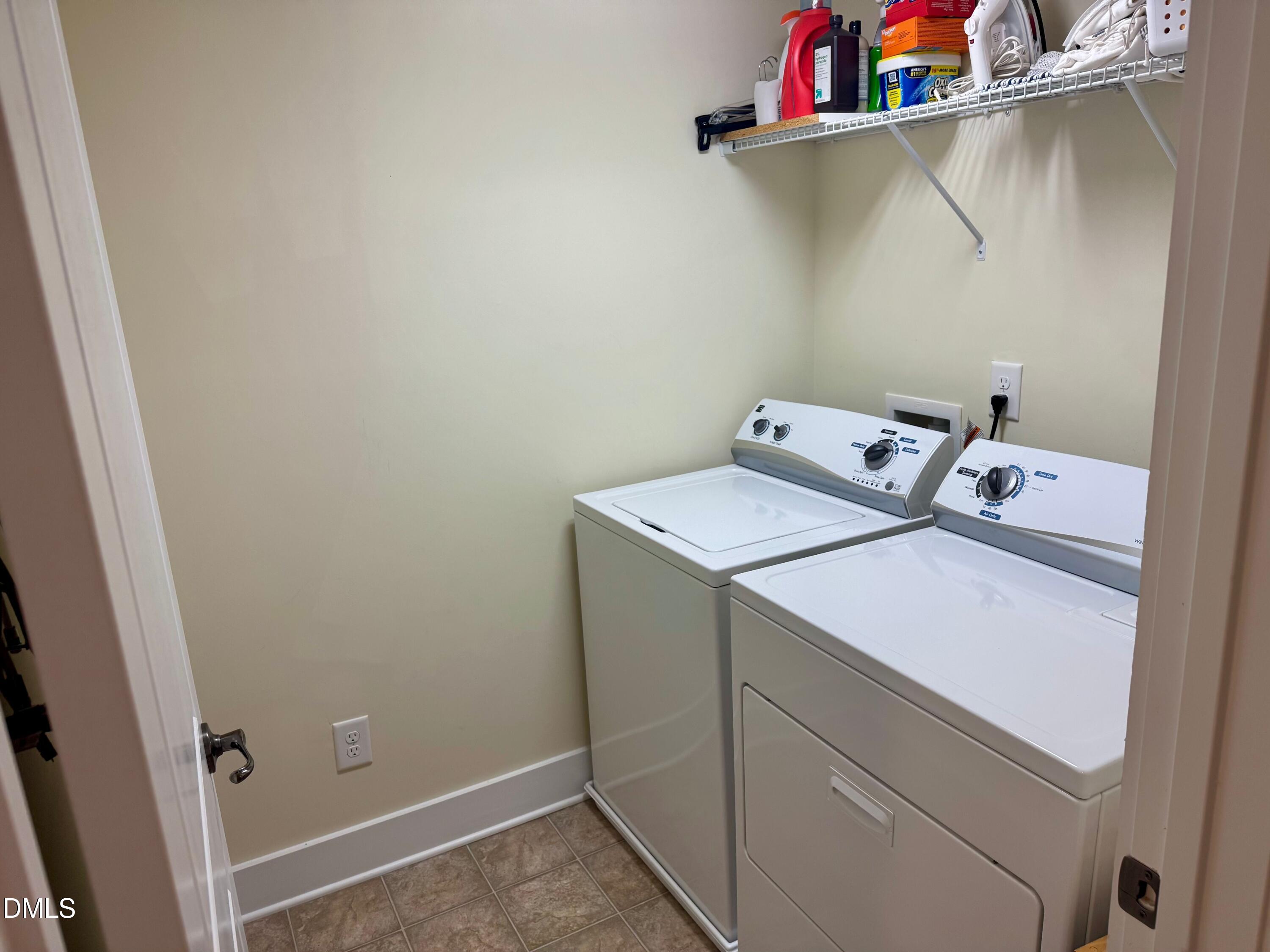 9302 Alcazar Walk Raleigh, NC 27617 - Photo 26 of 40 a utility room with dryer and washer