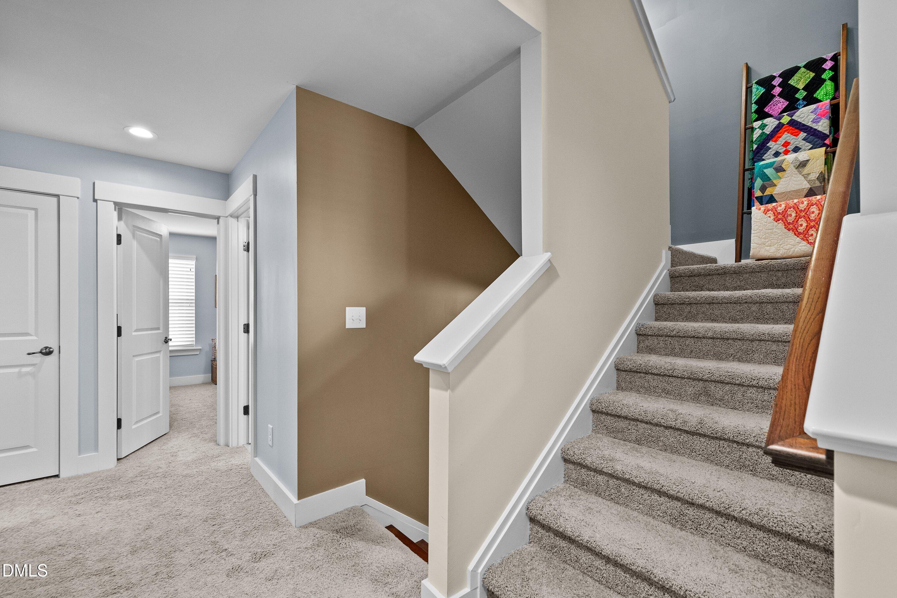 9302 Alcazar Walk Raleigh, NC 27617 - Photo 27 of 40 a view of a hallway with painting on the wall