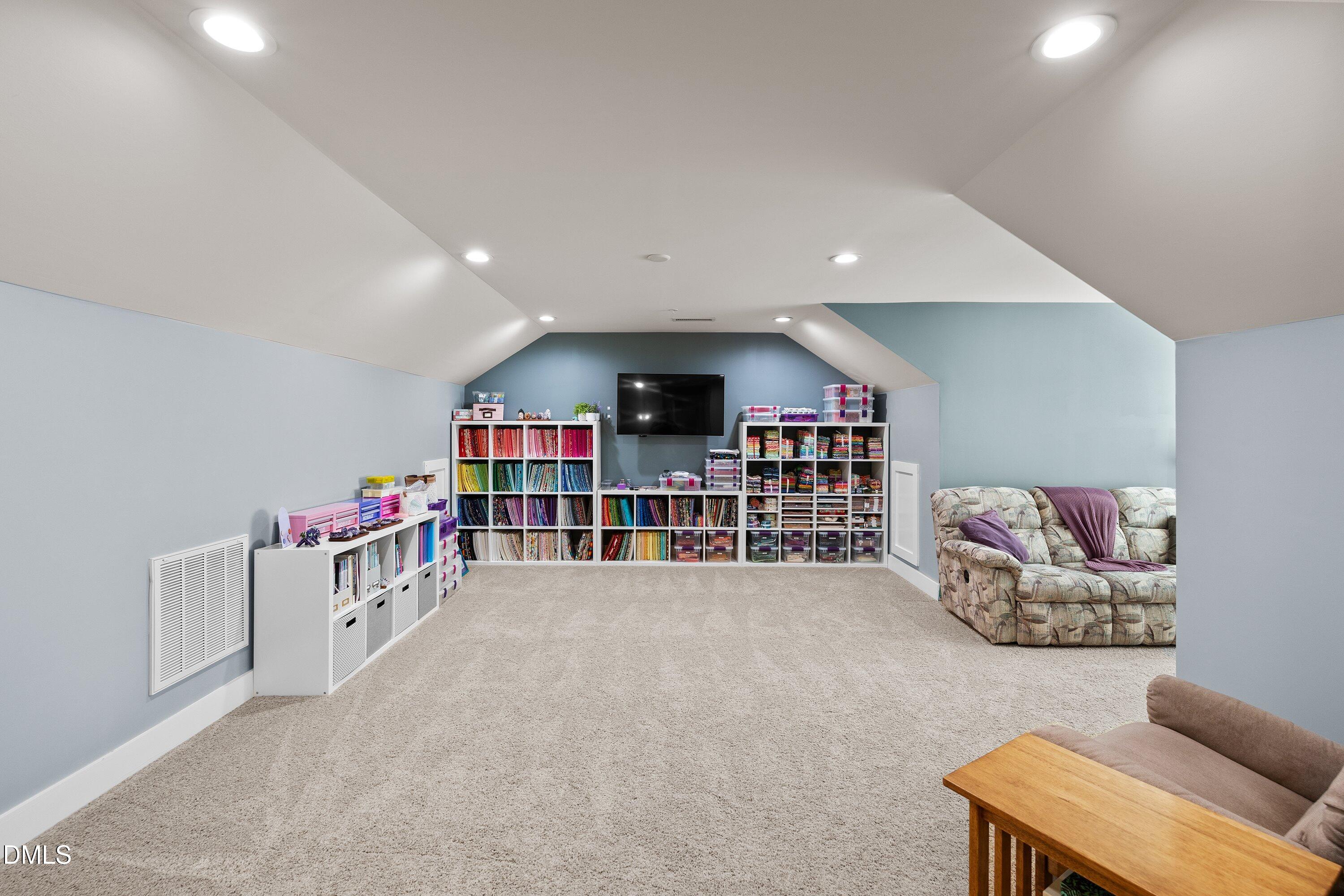 9302 Alcazar Walk Raleigh, NC 27617 - Photo 28 of 40 a living room with lots of furniture and a large window