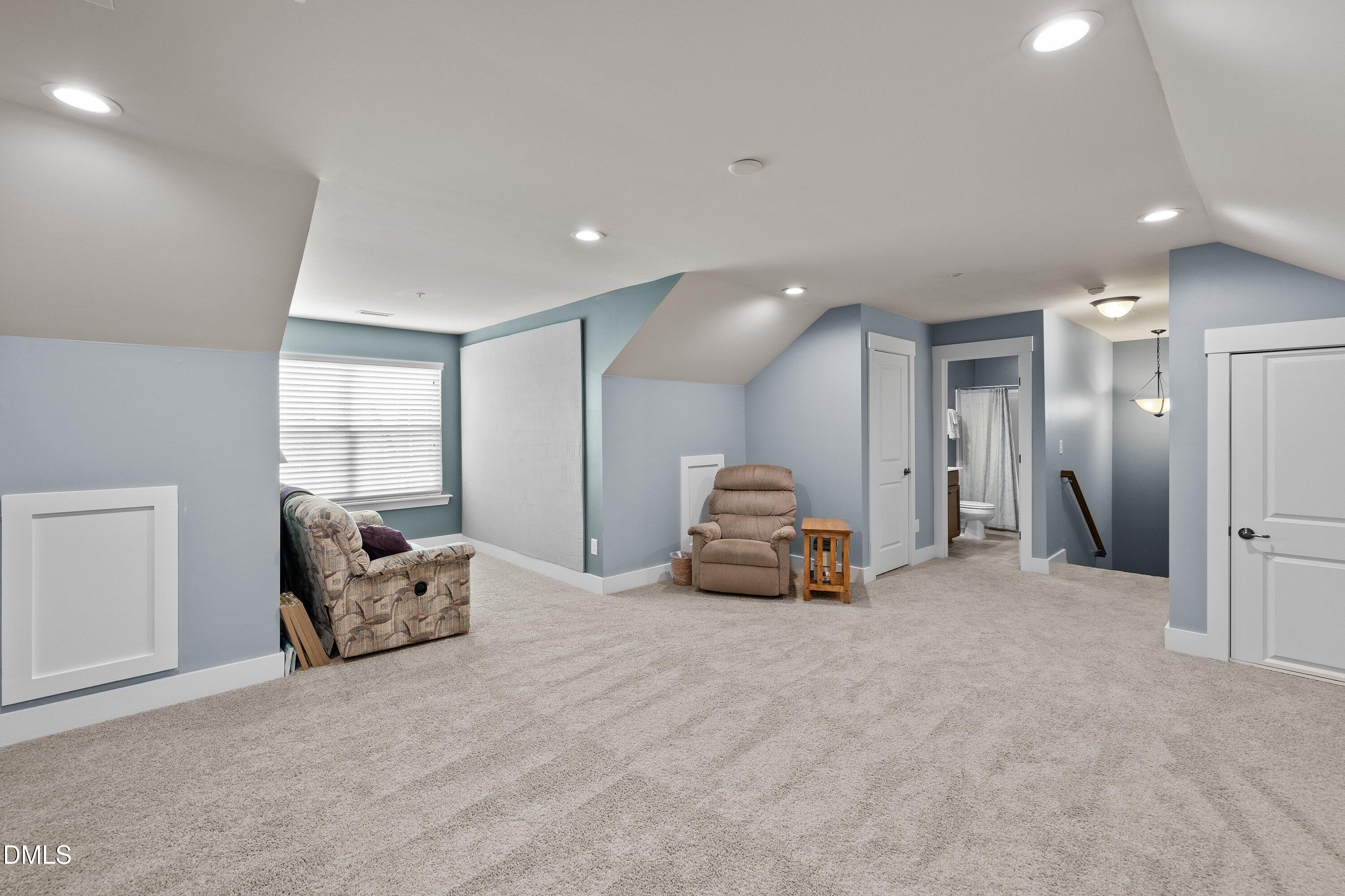 9302 Alcazar Walk Raleigh, NC 27617 - Photo 29 of 40 a view of a livingroom with furniture and a large window