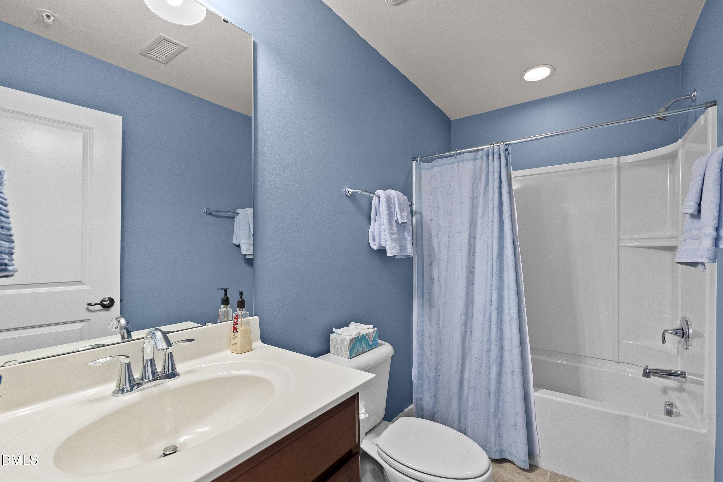 9302 Alcazar Walk Raleigh, NC 27617 - Photo 30 of 40 a bathroom with a sink toilet and shower