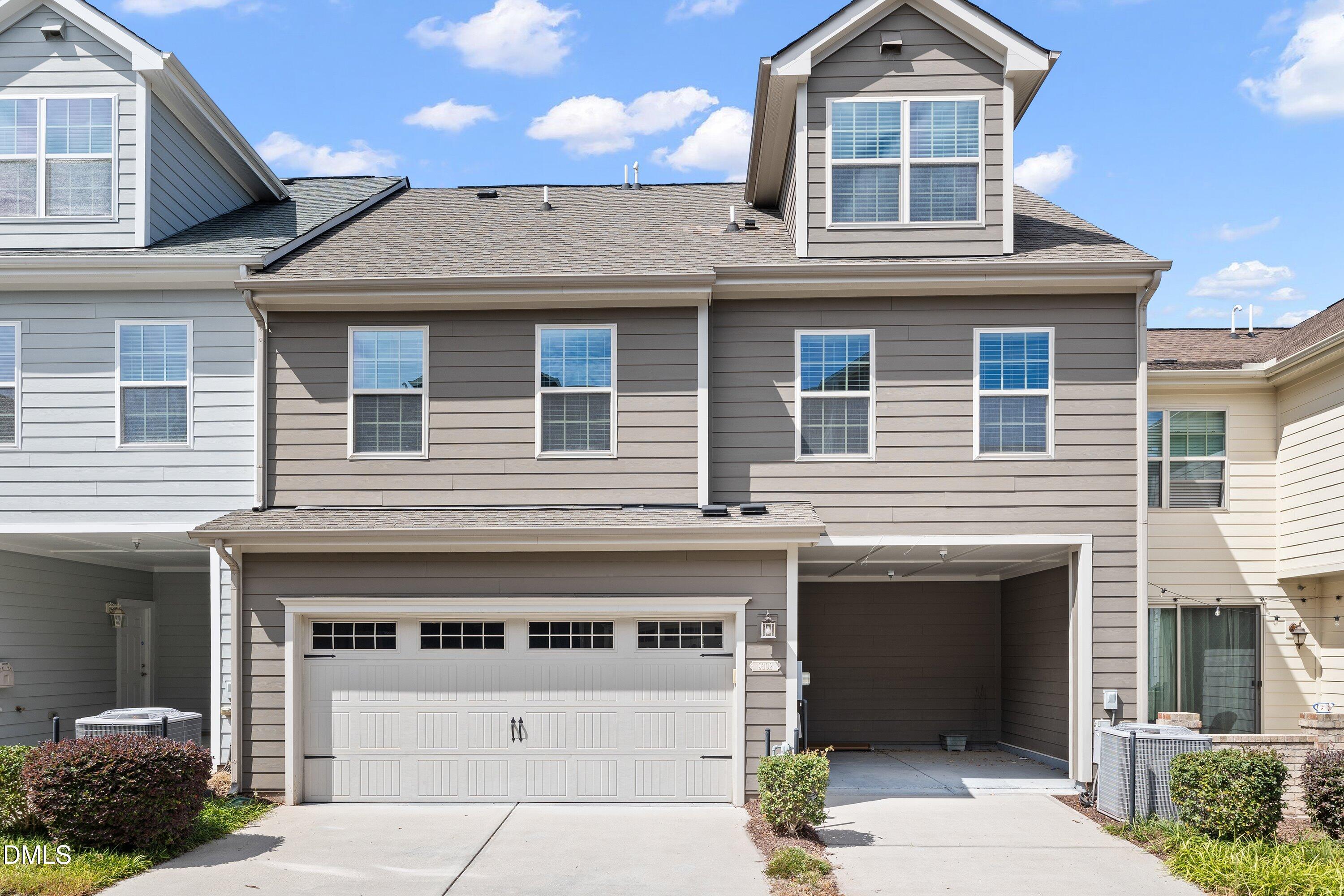 9302 Alcazar Walk Raleigh, NC 27617 - Photo 31 of 40 a front view of a house with a garage