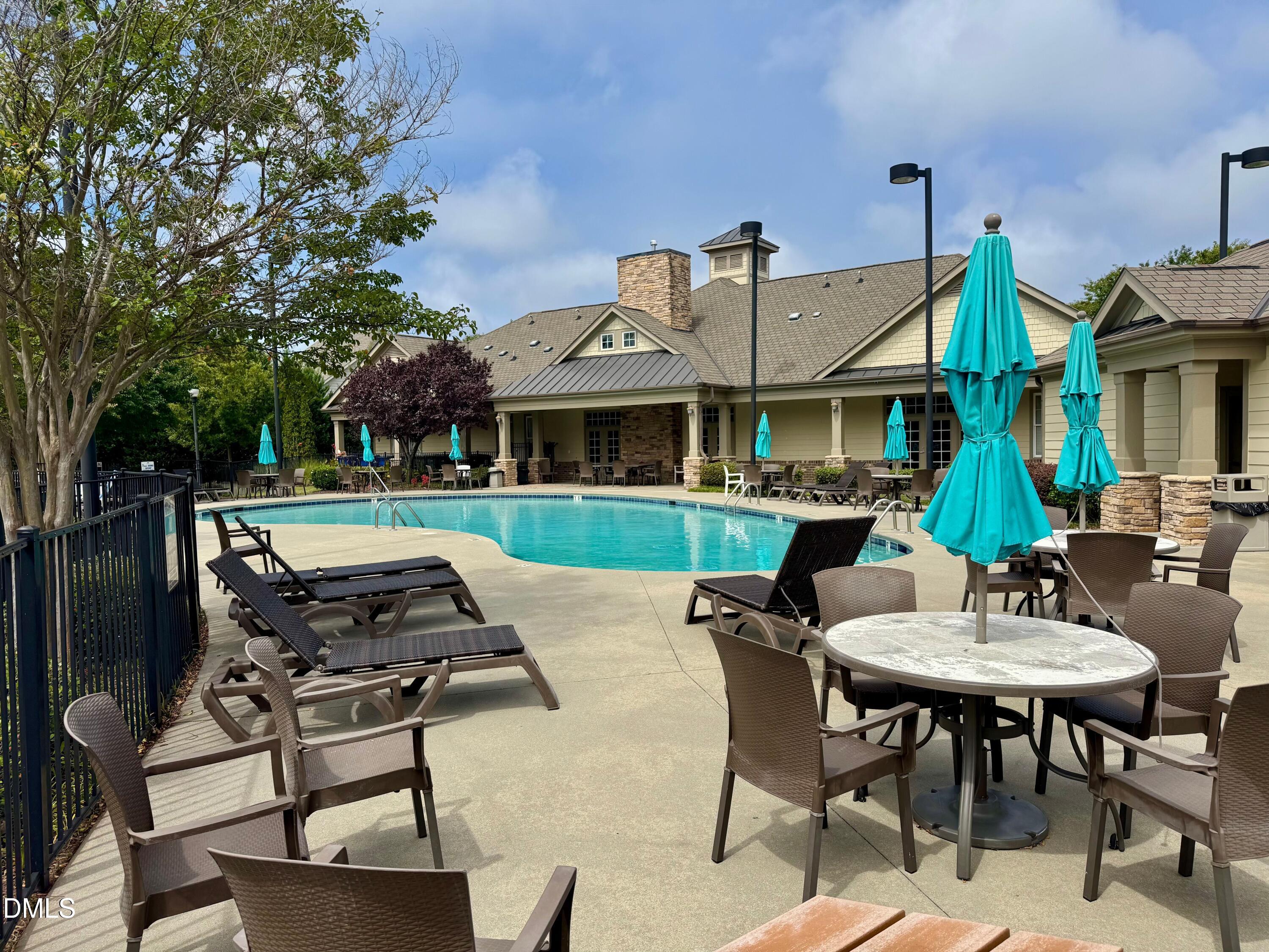 9302 Alcazar Walk Raleigh, NC 27617 - Photo 37 of 40 a patio with a table and chairs