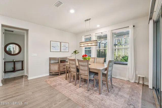 a bathroom with a toilet a sink and a mirror