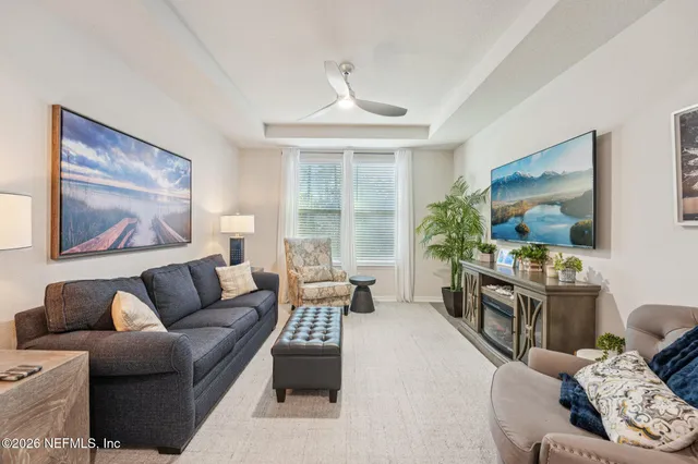 a view of walk in closet with clothes