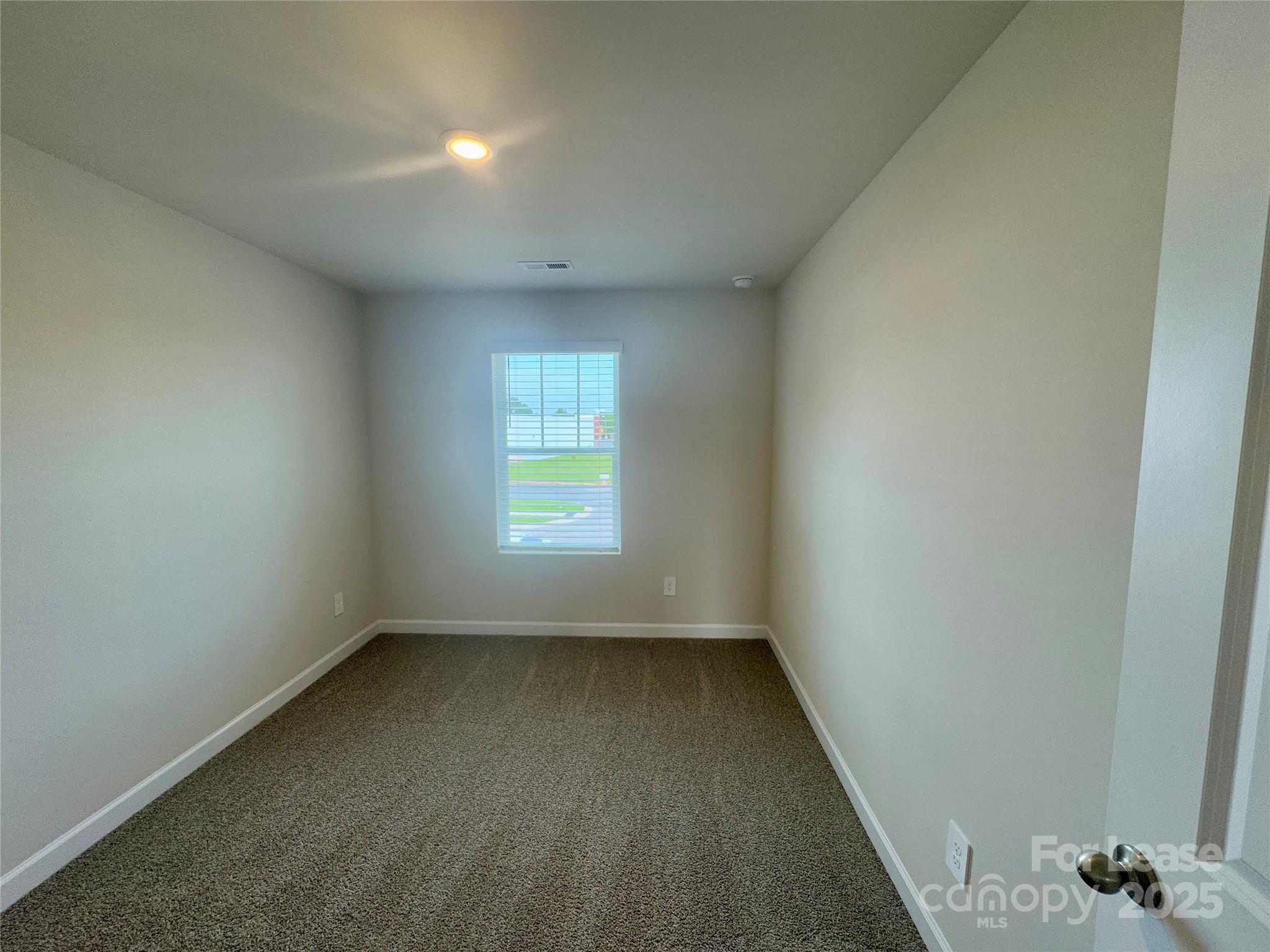 1650 Vlg Grv Lane Monroe, NC 28110 - Photo 16 of 23 an empty room with a window