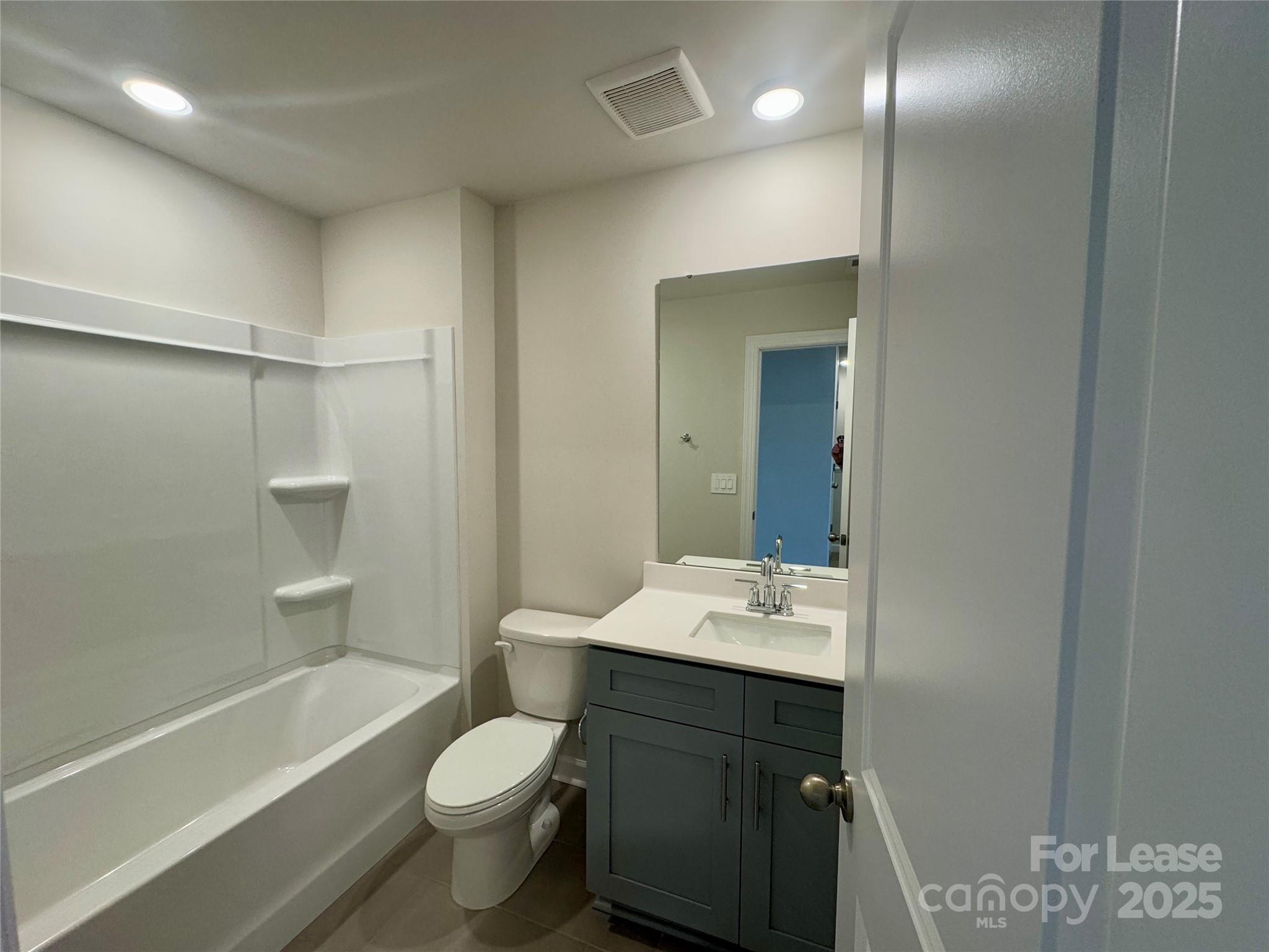 1650 Vlg Grv Lane Monroe, NC 28110 - Photo 18 of 23 a bathroom with a sink a toilet and shower