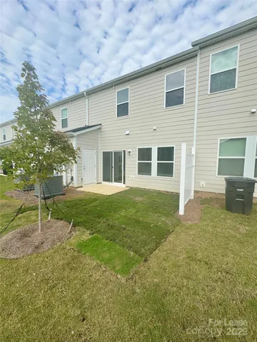 a backyard of a house with seating space