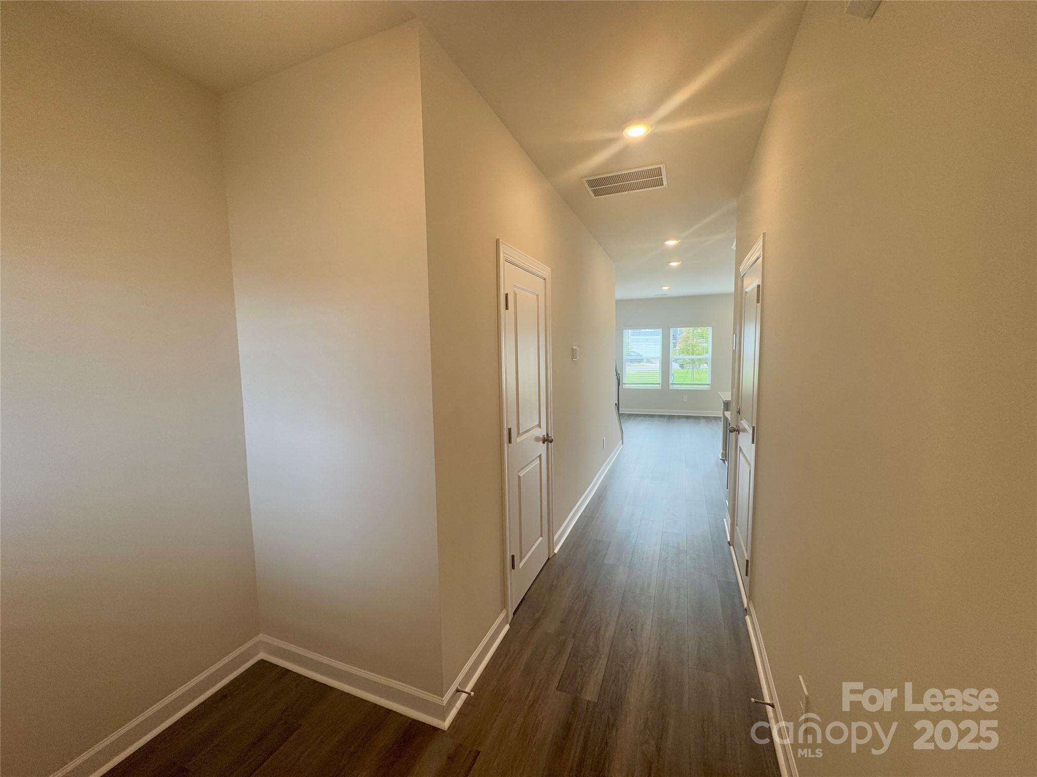 1650 Vlg Grv Lane Monroe, NC 28110 - Photo 4 of 23 a view of a hallway with wooden floor