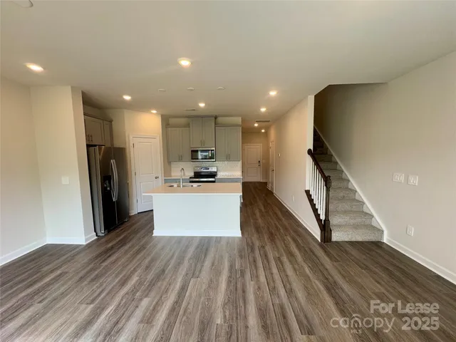 a view of kitchen with cabinets and stainless steel appliances