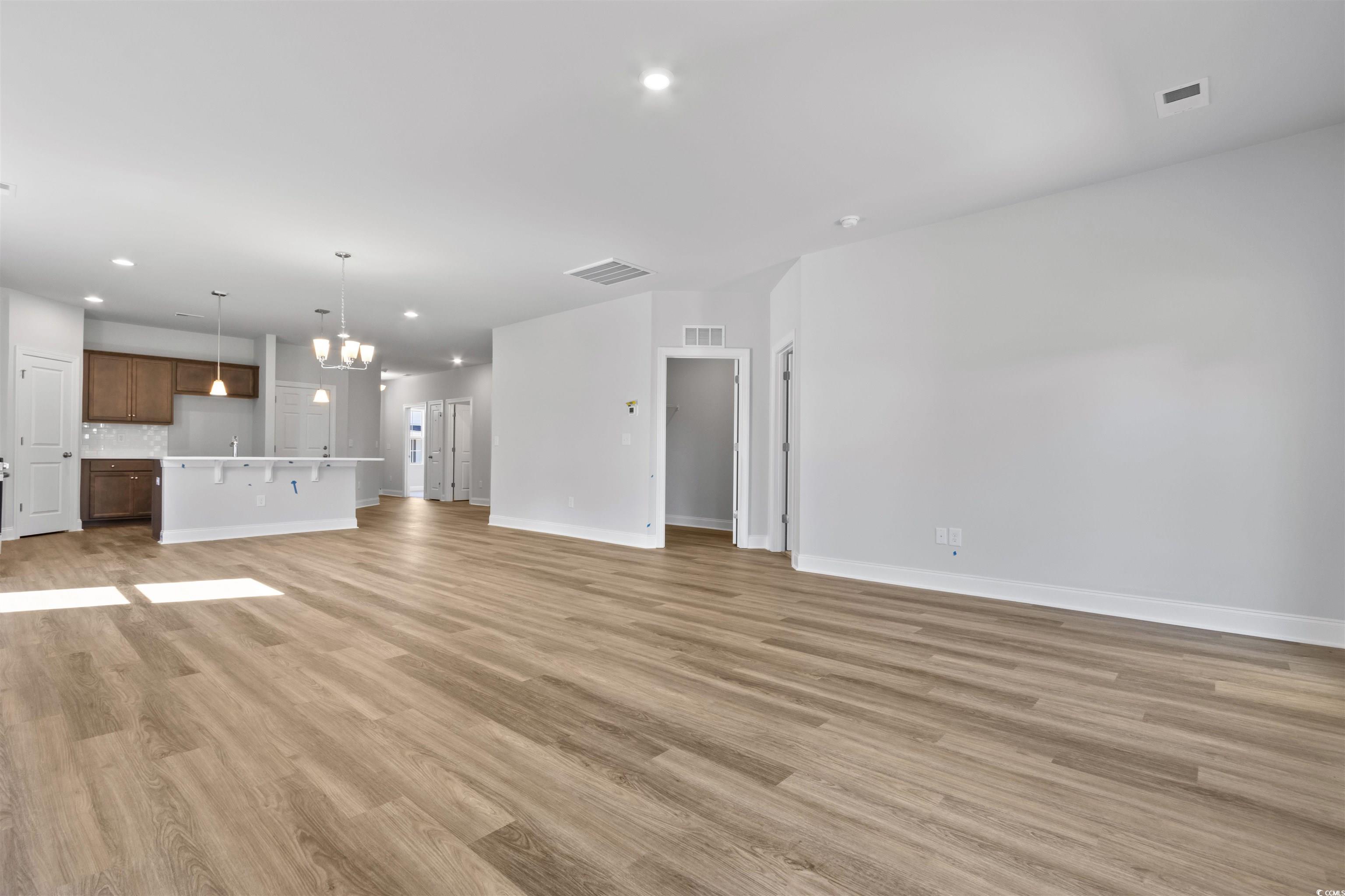 2461 Campton Loop Conway, SC 29527 - Photo 12 of 33 Unfurnished living room featuring an inviting chan