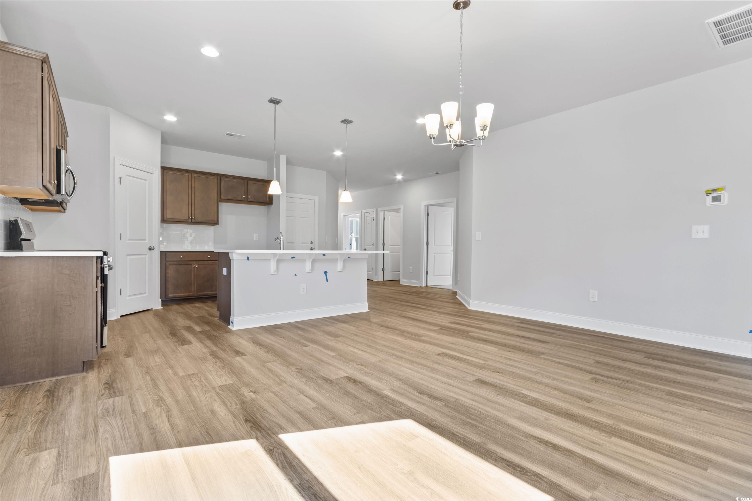 2461 Campton Loop Conway, SC 29527 - Photo 8 of 33 Kitchen with a kitchen island with sink, pendant l