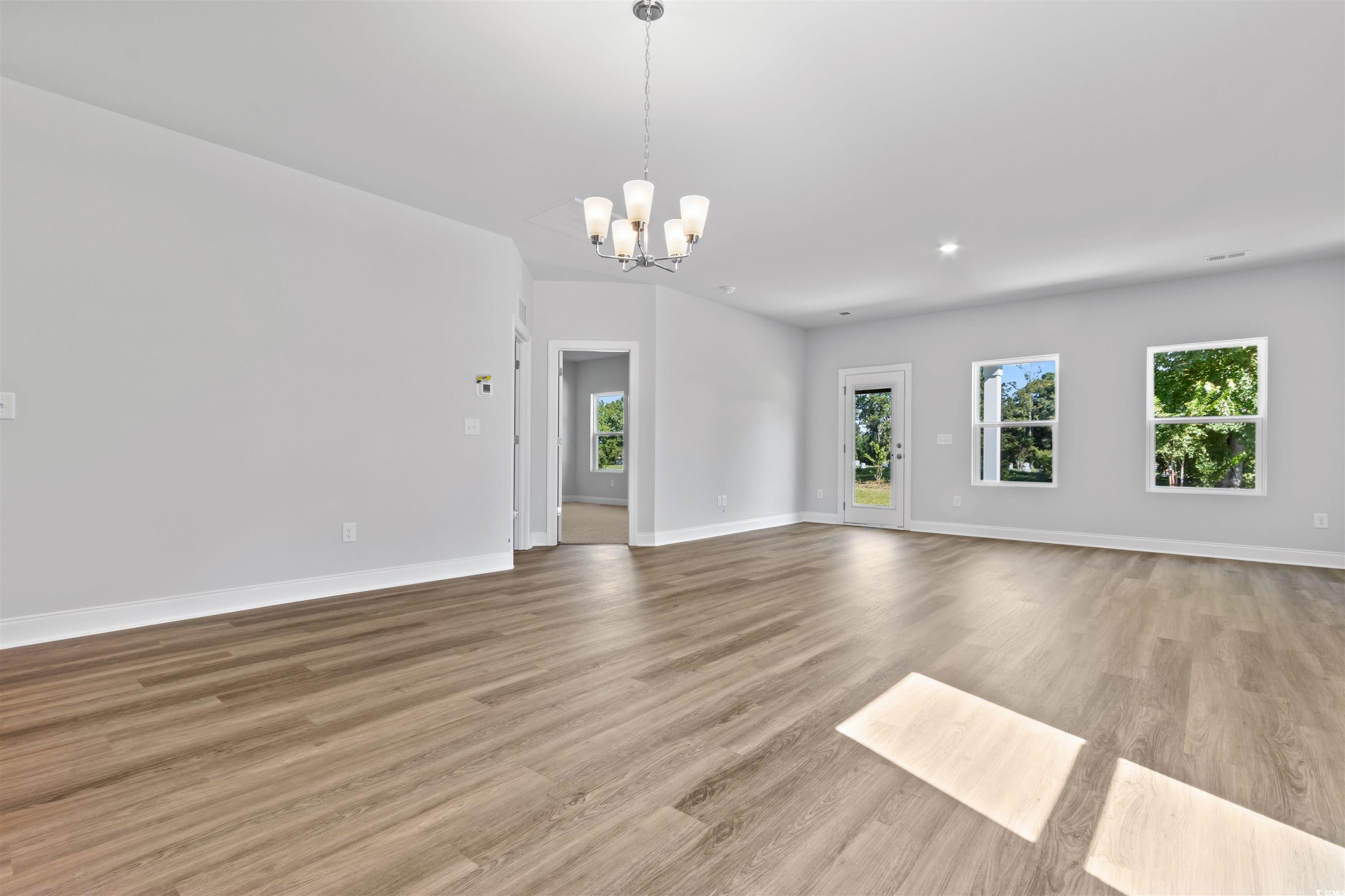 2461 Campton Loop Conway, SC 29527 - Photo 10 of 33 Unfurnished living room with light wood-type floor