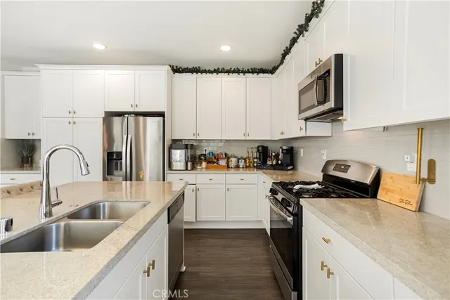 a view of a a dining room with furniture window and wooden floor