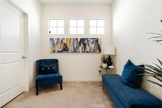 a view of workspace with furniture and window