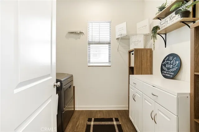 a view of living room with patio furniture and potted plants