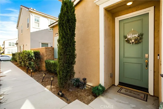 a view of entryway with wooden floor and stairs