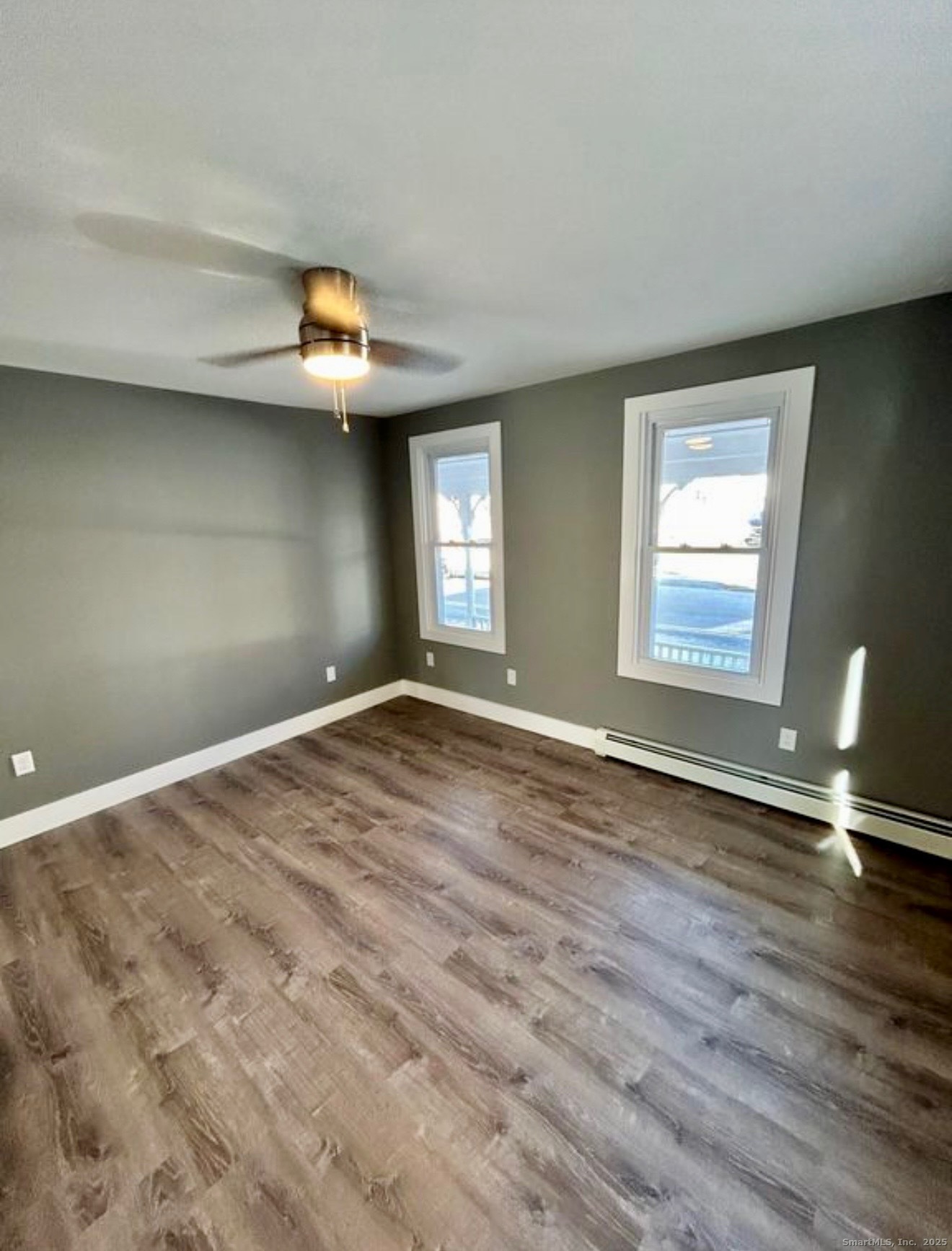 49 Trumbull Avenue Stonington, CT 06378 - Photo 5 of 14 a view of empty room with wooden floor and fan