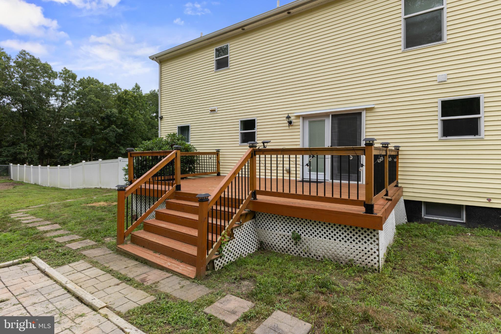 239 Shaws Mill Road Cedarville, NJ 08311 - Photo 27 of 39 Backyard deck with lush greenery.