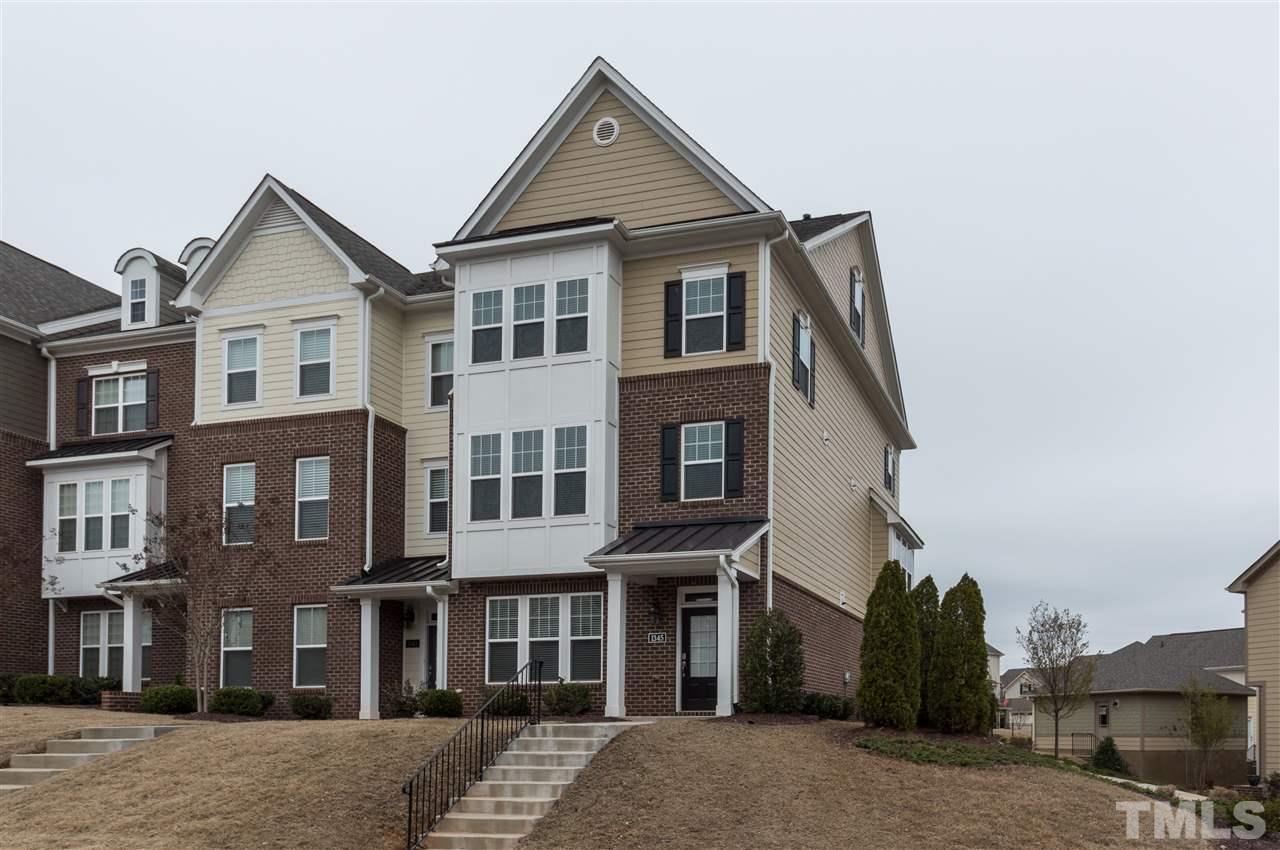 1345 Rodessa Run Raleigh, NC 27607 - Photo 1 of 24 a front view of a house with a yard