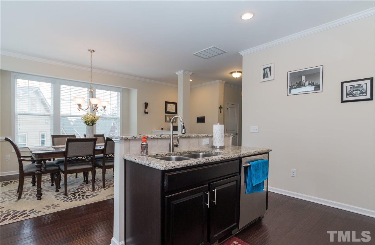 1345 Rodessa Run Raleigh, NC 27607 - Photo 12 of 24 a view of a dining room with furniture window and wooden floor