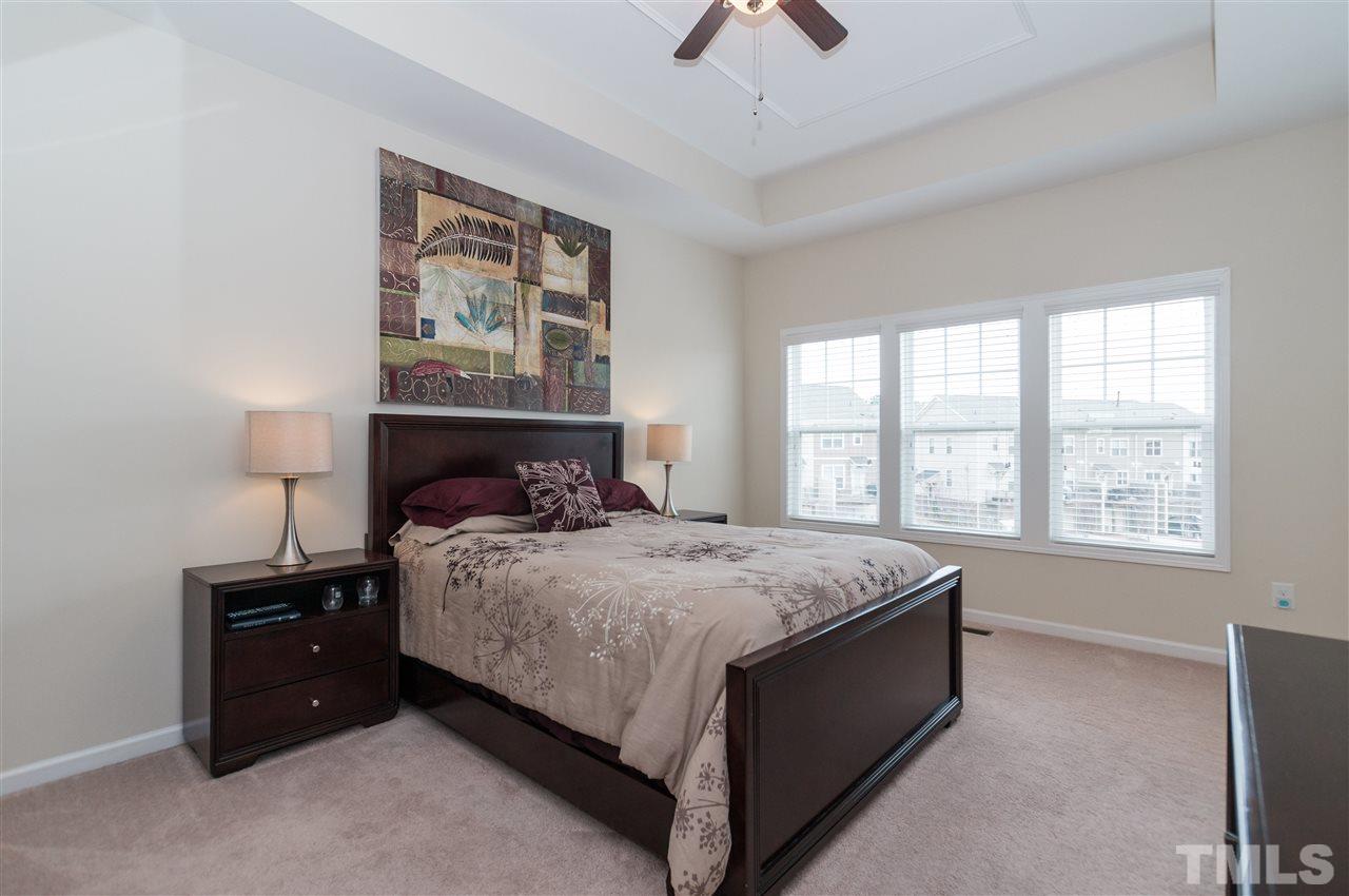 1345 Rodessa Run Raleigh, NC 27607 - Photo 15 of 24 a bed sitting in a bedroom next to a window