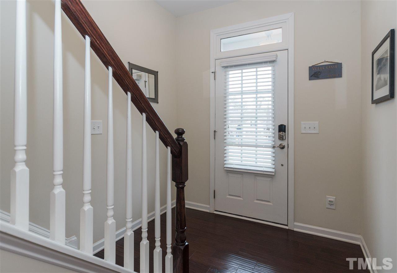 1345 Rodessa Run Raleigh, NC 27607 - Photo 3 of 24 a view of an entryway with wooden floor
