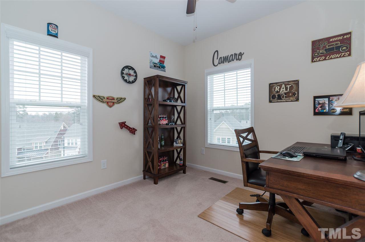 1345 Rodessa Run Raleigh, NC 27607 - Photo 22 of 24 a view of a workspace with furniture and a window