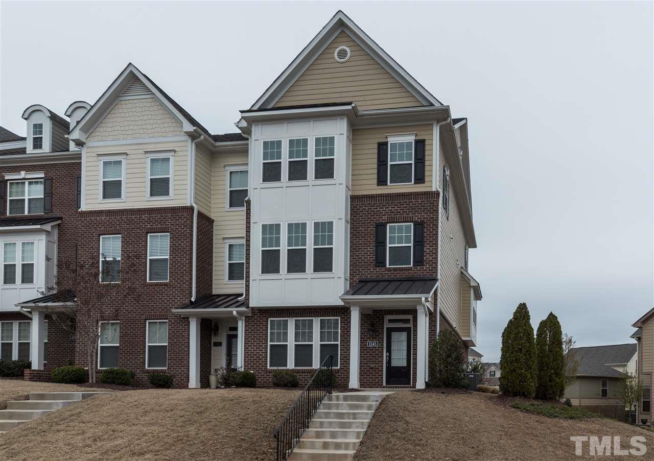 1345 Rodessa Run Raleigh, NC 27607 - Photo 24 of 24 a view of a brick house with many windows