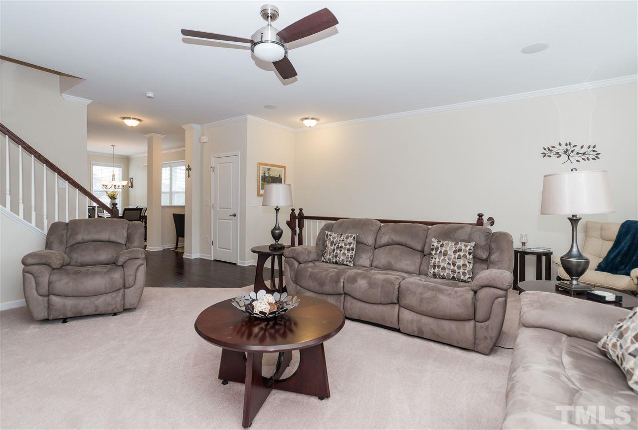 1345 Rodessa Run Raleigh, NC 27607 - Photo 7 of 24 a living room with furniture and a wooden floor