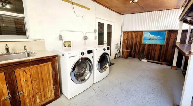 a utility room with dryer and washer