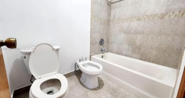 a bathroom with a sink and toilet