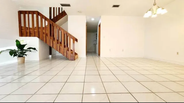 a view of an entryway with a flower pot