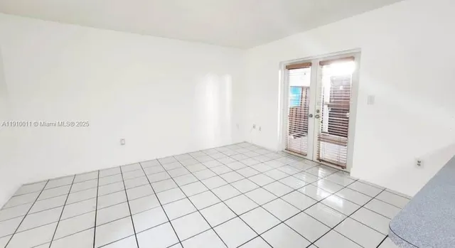 a view of an empty room and window