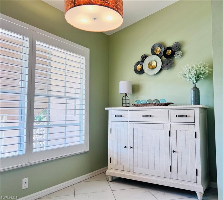 8073 Panther Trail, Unit 1404 Naples, FL 34113 - Photo 7 of 29 a room with cabinets and window