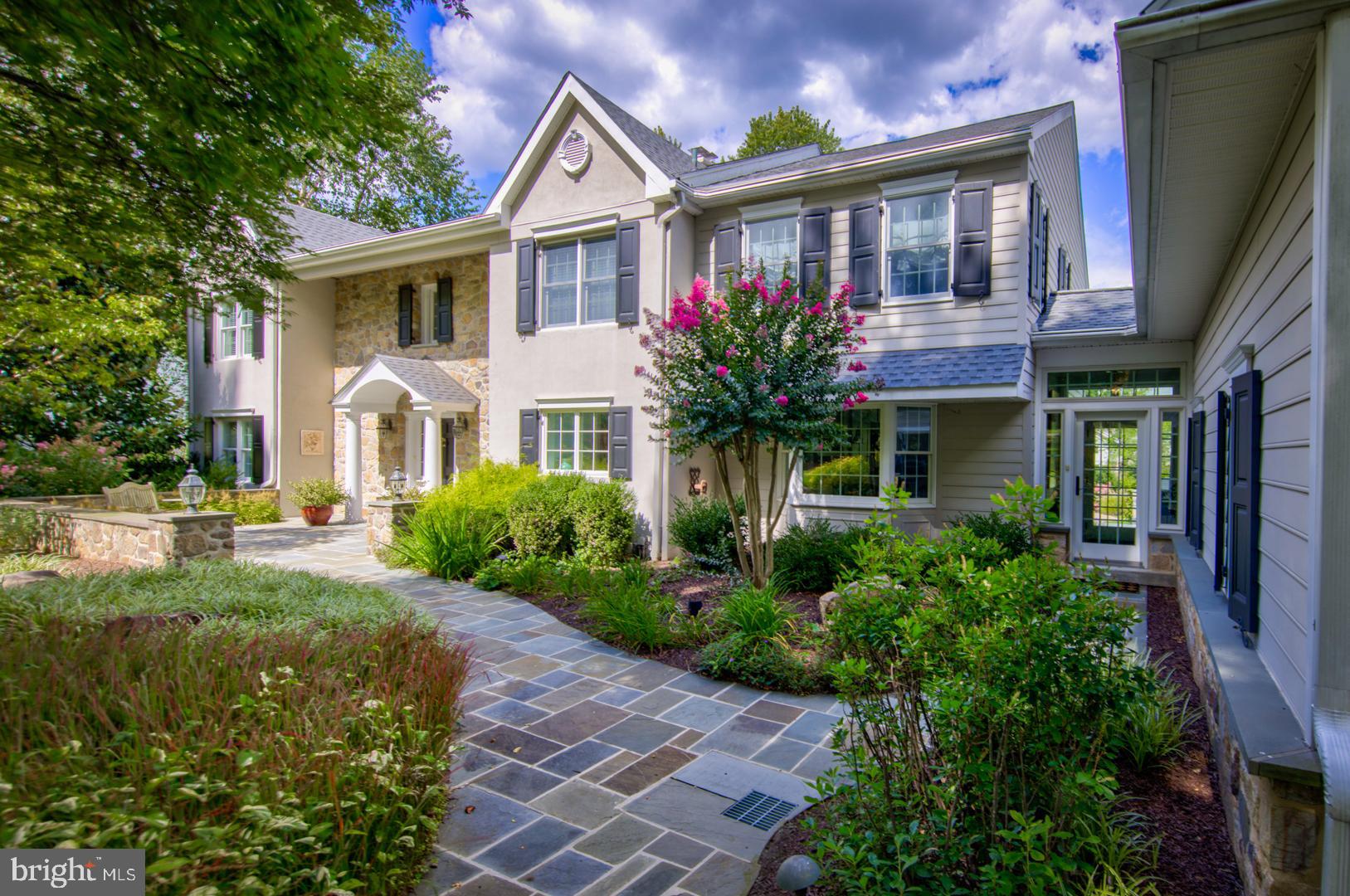 a front view of a house with garden