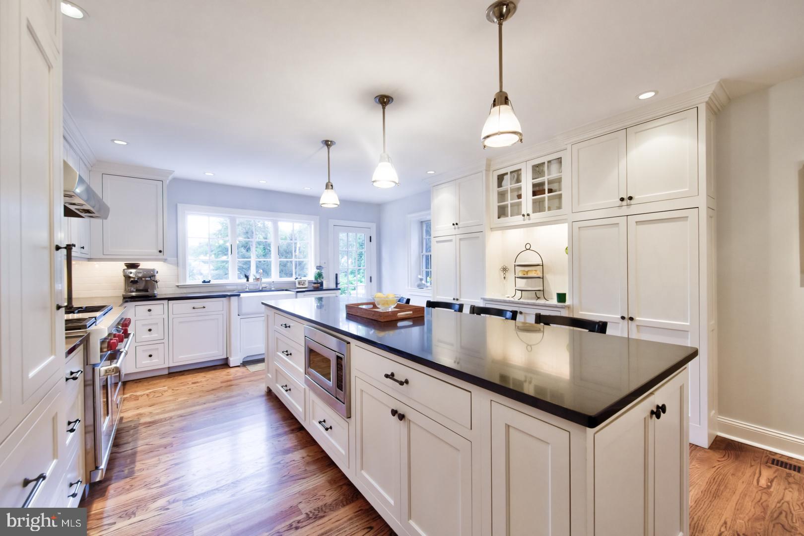 228 South Fairfield Road Devon, PA 19333 - Photo 23 of 61 a large kitchen with stainless steel appliances granite countertop a sink a stove and a wooden floors