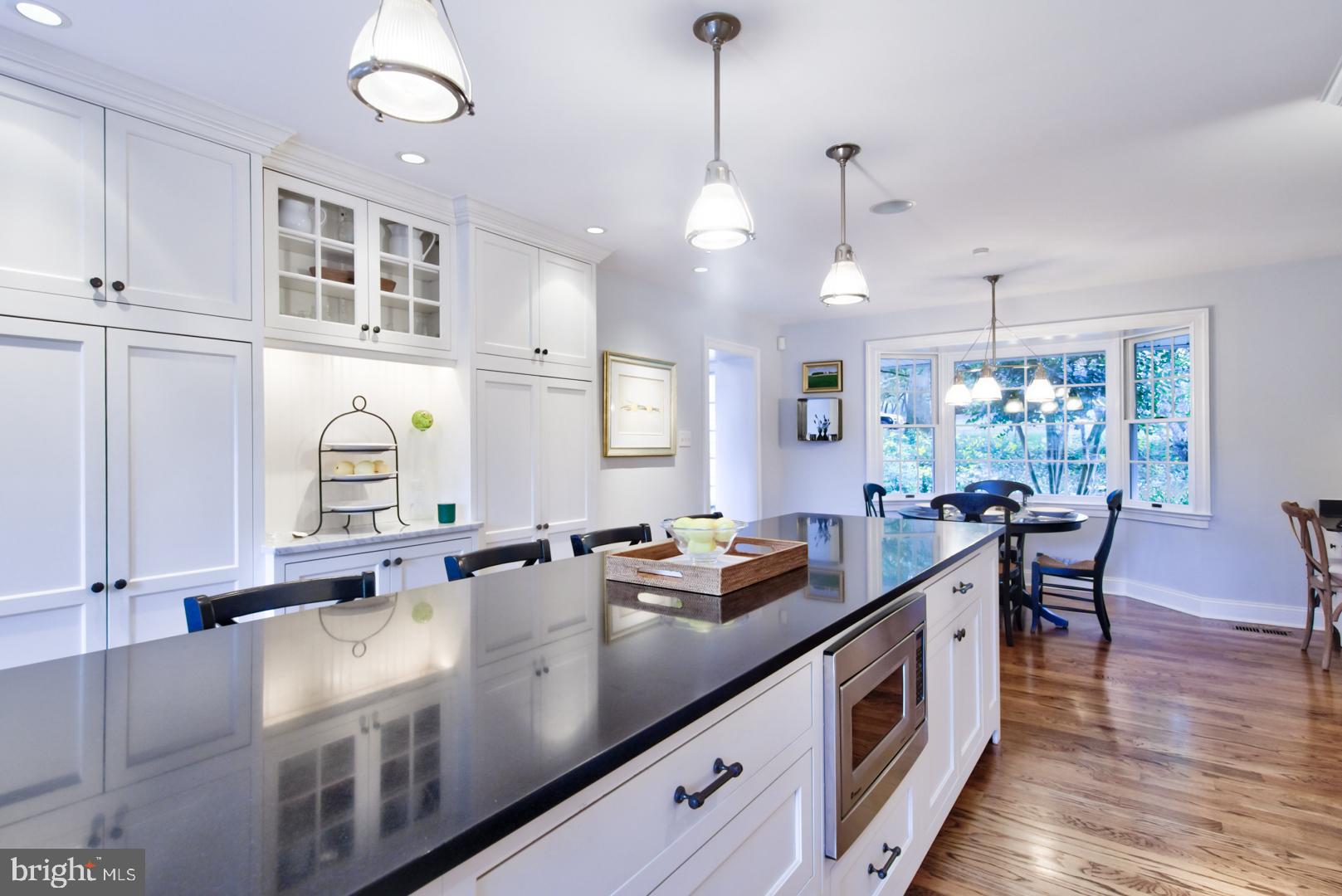 228 South Fairfield Road Devon, PA 19333 - Photo 26 of 61 a open kitchen with stainless steel appliances granite countertop a sink a stove and a wooden floors
